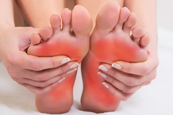 Podiatrist examining a patient with foot pain at Arcadia Foot and Ankle in Scottsdale, AZ